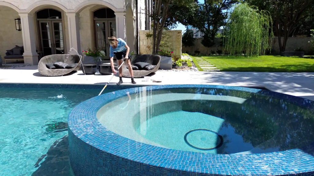 Pool cleaner working in backyard